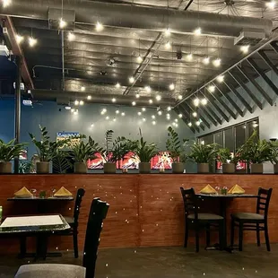 Calm bar area with attached high-top dining area, and partially separated quiet dining. The lighting!!