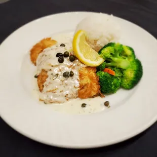 Chicken Piccata. Lightly egg battered and pan seared chicken with lemon caper butter sauce.