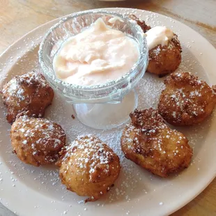 pineapple fritters with a mango crème sauce