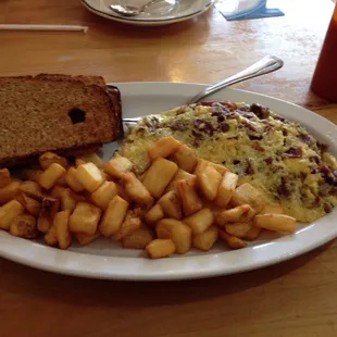 The Raceway Omelet with breakfast potatoes and wheat bread.