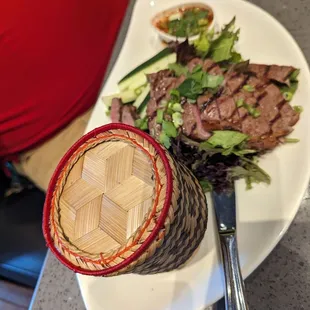 First time I've seen sticky rice served in a tiny basket. Nice touch