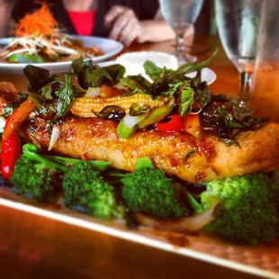 Nightly special of crusted walleye with steamed veggies and THE best red chili sauce. Very well priced and to die for