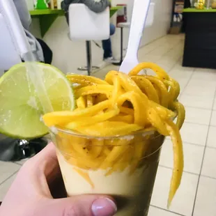 Spiraled mango with mango smoothie- my favorite! You can pick toppings if you want!