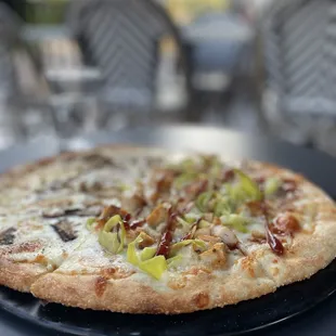 This is The goat and BBQ chicken pizzas (half and half).