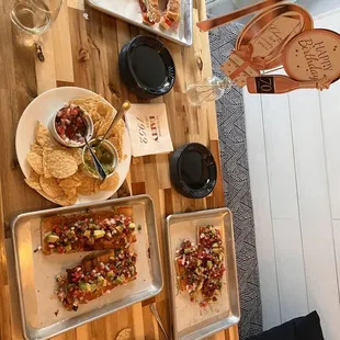 Coastal turkey sandwiches, chips with pico and guac, and Cuban bruschetta