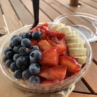 a bowl of fruit on a table