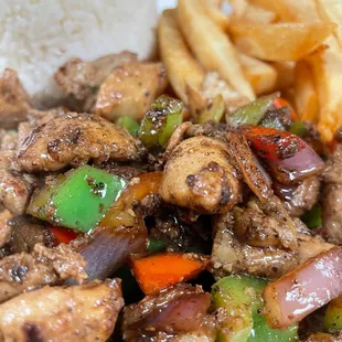 Smoke stir fry chicken thigh with veggies fries and rice