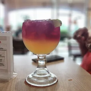 a colorful drink in a glass