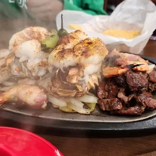 Primo Plato for 2 with 2 lobster tails and bacon wrapped shrimp, chicken, carne, onions and peppers...so good!