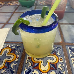 a margarita with a lime garnish