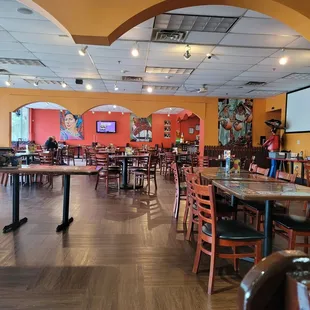 Open floor plan with bar in back corner