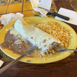 Steak burrito with a big chunk of tough meat, rather bland beans, and rice