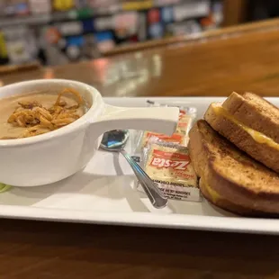 a bowl of soup and a sandwich