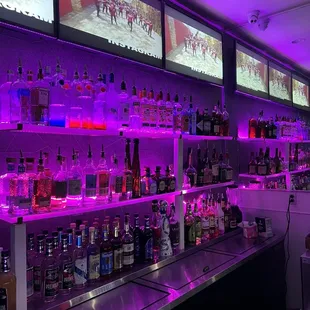 a bar with purple lighting