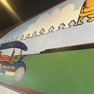 a mural of a golf cart