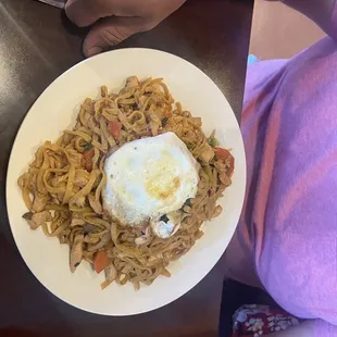 Pad see ew with chicken and egg on top