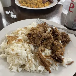 Pernil with white rice is always delicious. In background my wife had chicken stew with yellow rice and maduros. All great!