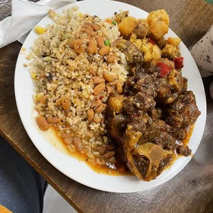 Oxtail with rice and beans. And a side of potatoes.