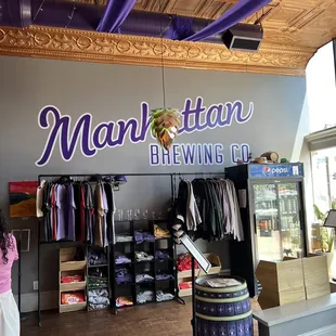 a woman standing in front of the store