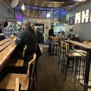 customers sitting at the bar