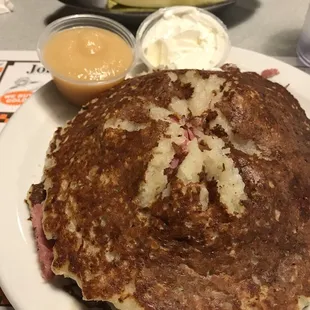 Potato pancakes stuffed with corned beef. Side of sour cream and apple sauce