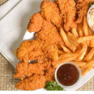 a plate of fried chicken and french fries