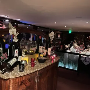 a bar with bottles of wine