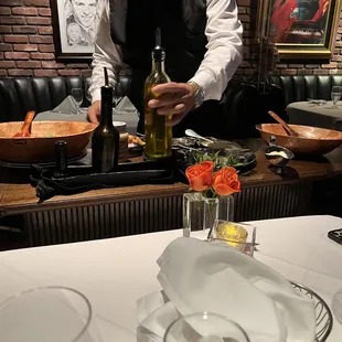 Table side Caesar Salad preparation