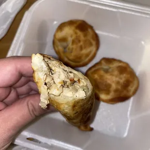 a hand holding a pastry