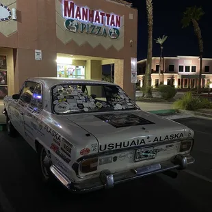 a car parked in front of a restaurant