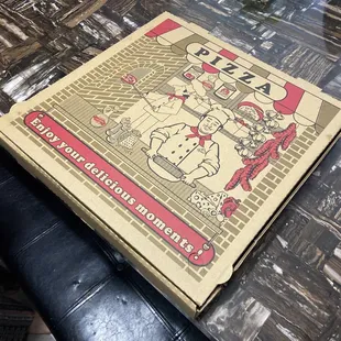 a pizza box on a table