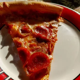 a slice of pepperoni pizza