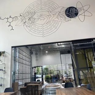 Indoor dining area with view of the inner sanctum and art work