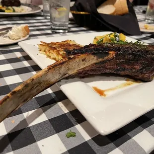 Rear end of Tomahawk 32 oz. Steak. Med rear with a delicious crust. Veggies had a lot of flavor, as well as the hash's creamy crispness.