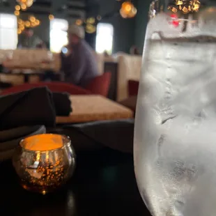 a glass of water with ice