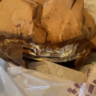 a sandwich wrapped in aluminum foil