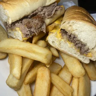 a plate of french fries and a sandwich