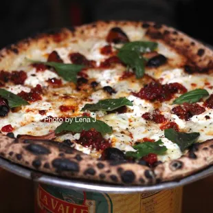 Quattro Formaggi ($20) - smoked mozzarella, provolone, ricotta, grana padano, tomato conserva, basil