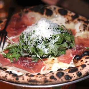 Arugula + Prosciutto Pizza ($22) - mozzarella, Ligurian olive oil, sea salt
