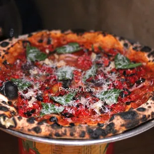 Puttanesca Pizza ($18) - Calabrian chili, oven roasted tomato, olive, red onion, parmesan