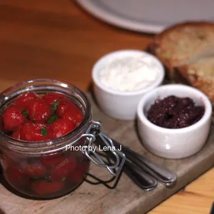 Pickled Tomatoes ($14) - whipped ricotta, tapenade, crostini
