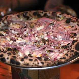 Red Onion + Pistachio Pizza ($21) - goat cheese, rosemary, garlic cream, chili flake