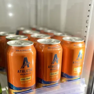 a fridge full of orange sodas