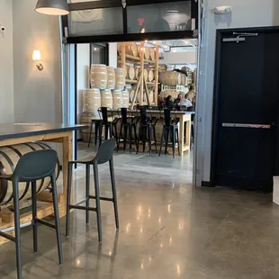 a bar with stools and tables