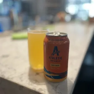 a can and a glass of beer