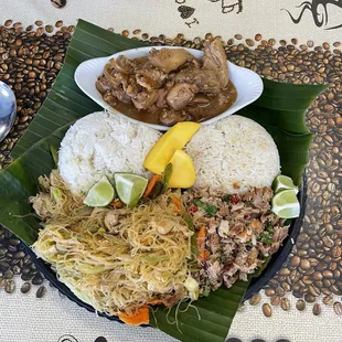 Chicken Adobo at the top Pancit Bihon at the bottom left Sisig on the bottom right