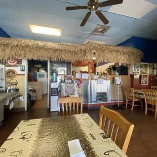 Front of dining area with register and kitchen area.