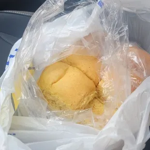 a sandwich wrapped in plastic