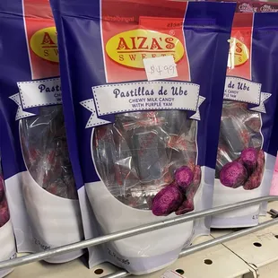 three bags of candies on a shelf