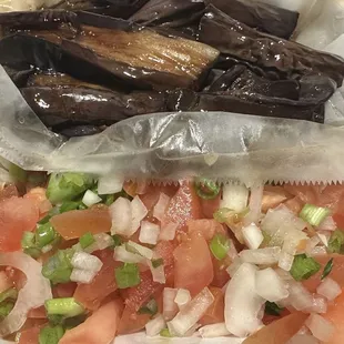 Talong (Grilled Egglant) and a side of tomatoes with onions